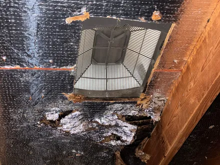 Leak in attic under roof vent two — emergency tarping in Katy & Greater Houston