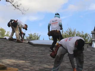 Rlynt Roofing crew member on a job in Katy, TX