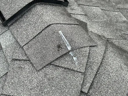 Roof hail damage missouri city texas one point five inch april 3 2026 one — hail-damaged roof documented for an insurance claim in Greater Houston