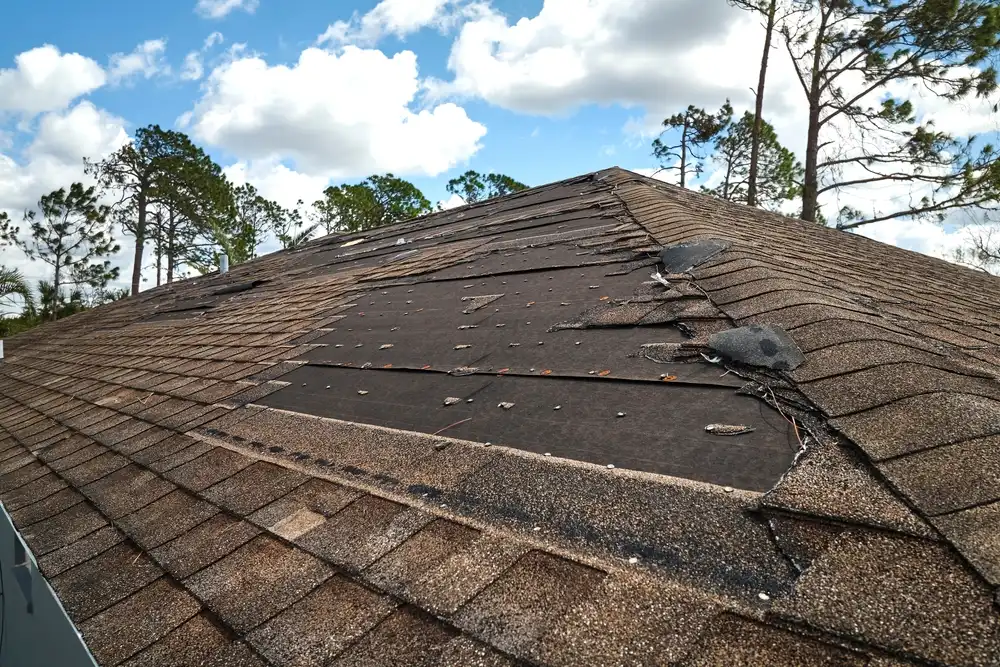 Wind-damaged roof in need of emergency tarping in Greater Houston